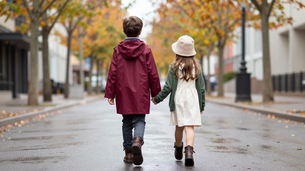Two children in stylish autumn outfits walking down a city street